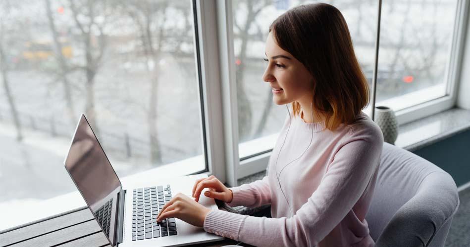 Girl working on laptop on HTML course