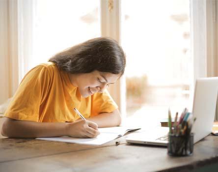 Girl making note on Java Technologies course 