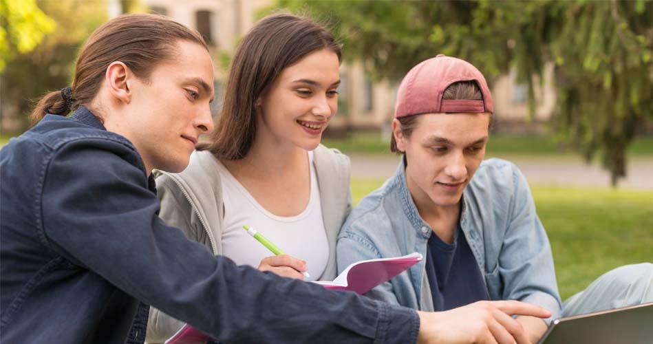 Group making notes on MS Office course