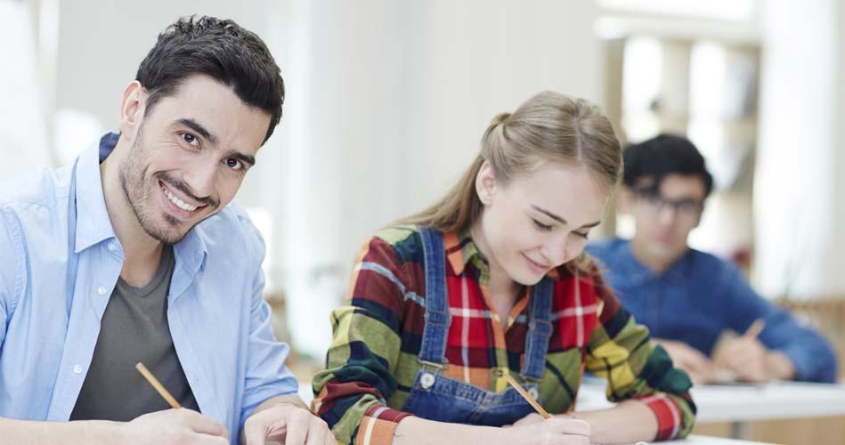 Students studying Pagemaker course in the classroom