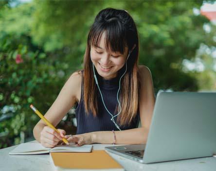 Girl making notes on WCF course