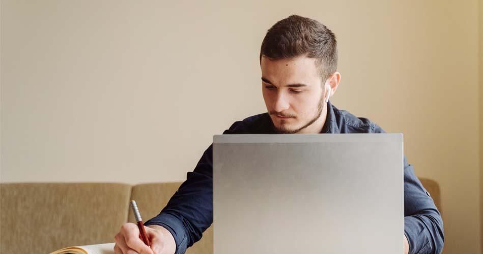 Boy making notes about WPF course